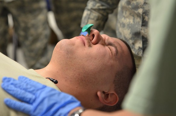 Soldier has a nasal pharyngeal airway inserted into nose for training.  Joint Base Mcguire-Dix-Lakehurst; Jan. 2014. 